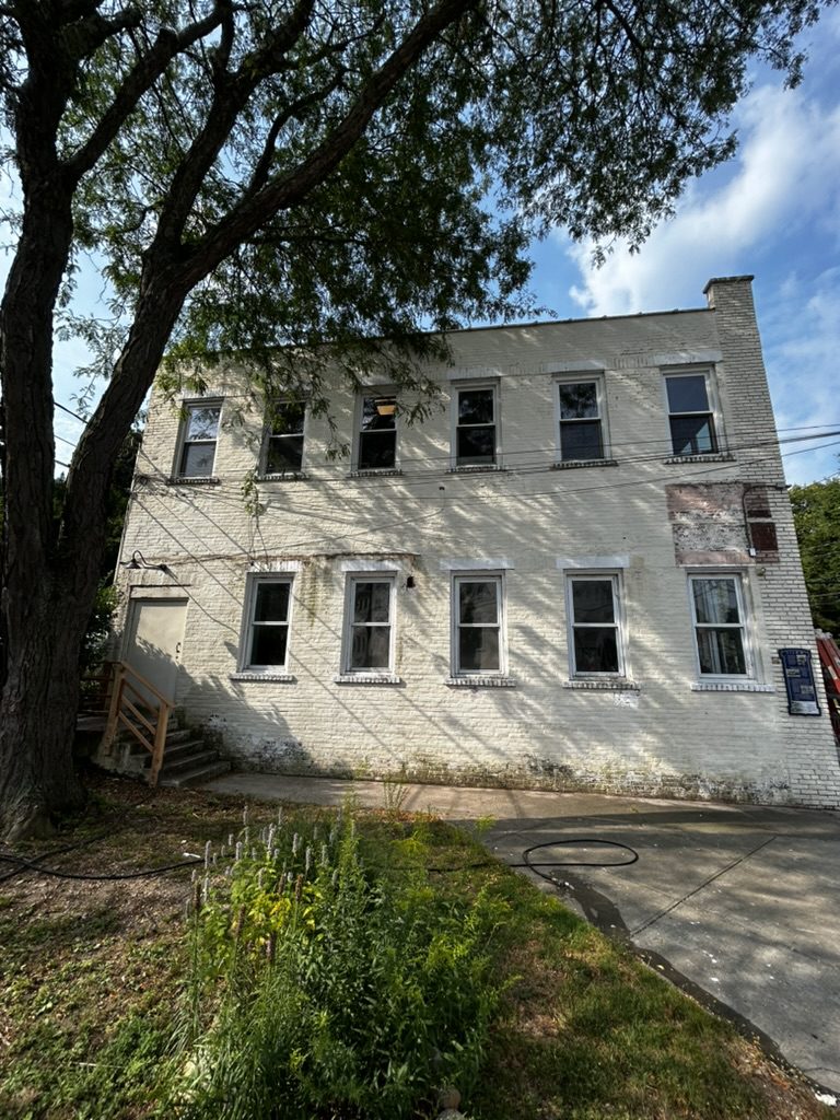 Commercial brick building before power washing